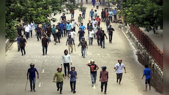 Bangladesh student protests as they unfolded: 'Helmet-wearing' men beat schoolchildren as cops stood and watched, say protesters