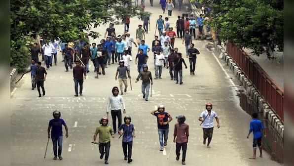 Bangladesh student protests as they unfolded: 'Helmet-wearing' men beat schoolchildren as cops stood and watched, say protesters