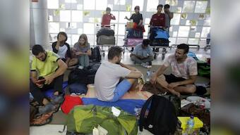 Tourists rush to escape Indonesia's Lombok as earthquake toll reaches 98; more than 20,000 left homeless