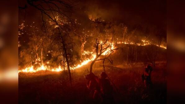 Twin blazes form California's largest wildfire in history, burn through 283,800 acres; two people killed