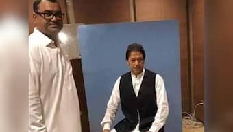 Pakistan's Prime Minister-in-waiting Imran Khan borrows waistcoat for official photo in Parliament