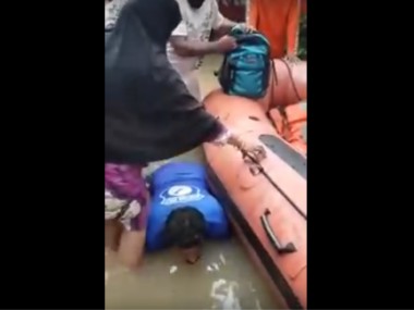 Kerala Floods: Video of man letting women use him as stepping stone to climb into boat goes viral, is dubbed 'humanity at its finest' Kerala Floods: Video of man letting women use him as stepping stone to climb into boat goes viral, is dubbed 'humanity at its finest'