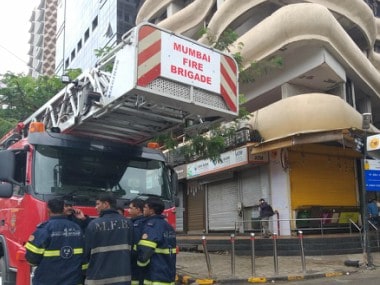Firemen outside Crystal Tower on Wednesday. Firstpost/Natsaha Trivedi