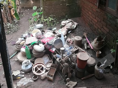 Utensils and other possessions lie piled up outside homes. Firstpost/Dinesh Unnikrishnan