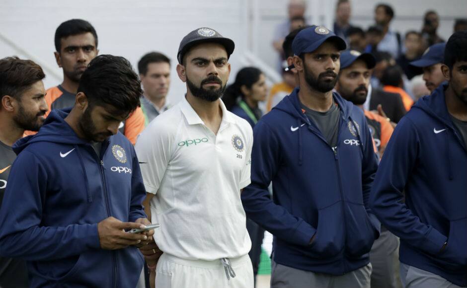 The gloomy Indian contingent look on during the presentation ceremony after losing the Oval Test by 118 runs. AP