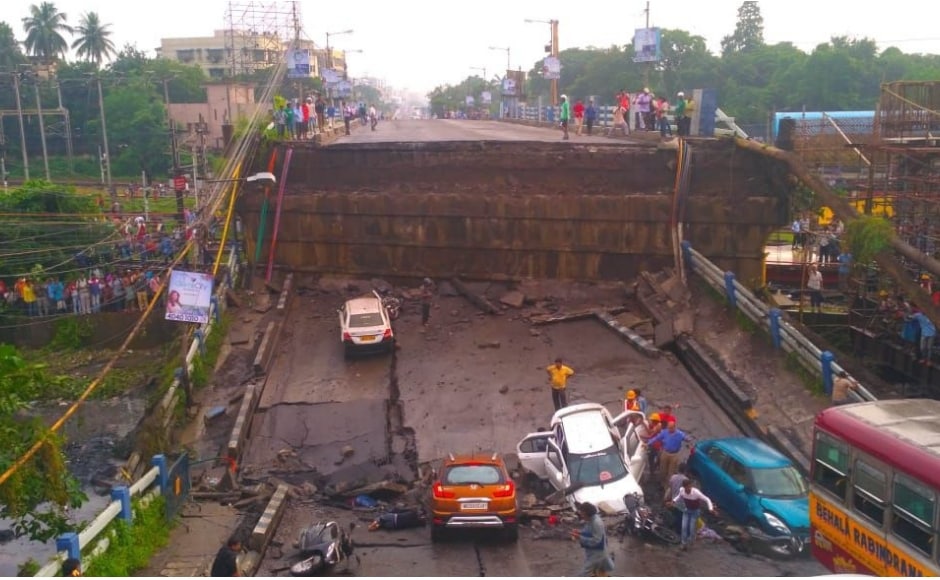 A portion of the arterial Majerhat bridge in south Kolkata's Alipore area collapsed on Tuesday evening, claiming one life, and trapping several people. Many vehicles were also stuck in the debris. Image courtesy: Sayantanee Choudhary/101Reporters A portion of the arterial Majerhat bridge in south Kolkata's Alipore area collapsed on Tuesday evening, claiming one life, and trapping several people. Many vehicles were also stuck in the debris. Image courtesy: Sayantanee Choudhary/101Reporters