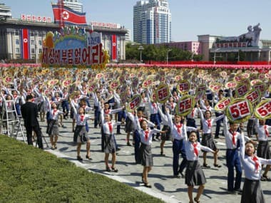 North Korea stages huge parade on country's 70th anniversary, holds back on advanced missile
