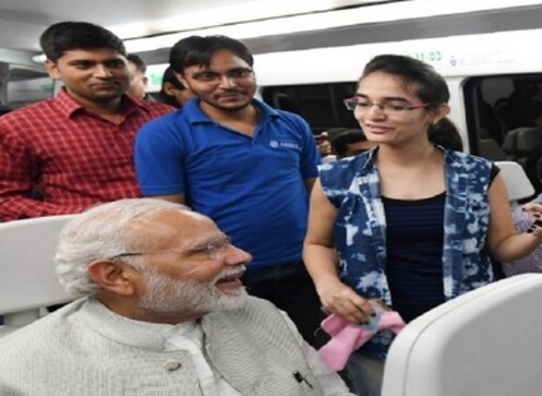 Narendra Modi takes Airport Metro ride to Dwarka event in Gujarat; PM obliges selfie request from passengers Narendra Modi takes Airport Metro ride to Dwarka event in Gujarat; PM obliges selfie request from passengers