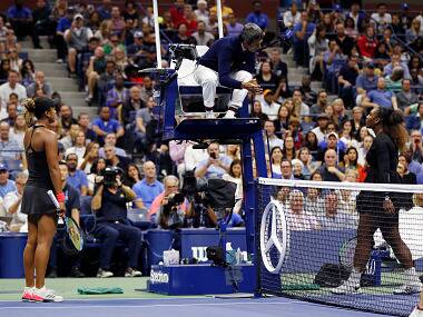 Serena Williams, right, talk with chair umpire Carlos Ramos as Naomi Osaka, of Japan, listens during the women’s final of the U.S. Open tennis tournament, Saturday, Sept. 8, 2018, in New York. (AP Photo/Adam Hunger)