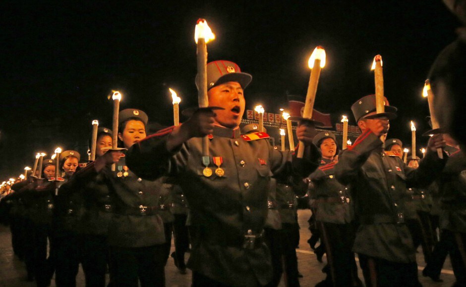 North Korean military cadets holding torches march during a torch light march at the Kim II Sung Square in conjunction with the 70th anniversary of North Korea's founding day in Pyongyang. AP North Korean military cadets holding torches march during a torch light march at the Kim II Sung Square in conjunction with the 70th anniversary of North Korea's founding day in Pyongyang. AP