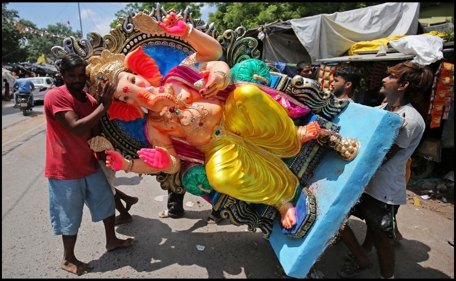 Artisans create massive idols for the Ganesh pooja and load them onto trucks to carry them to their places of worship in Ahmedabad. This practice is followed in several places throughout the country. This year, the ten-day long festival will end on 22 September, 2018 with the Anant Chaturdashi marking the immersion of the idols in the waters. Reuters/ Amit Dave Artisans create massive idols for the Ganesh pooja and load them onto trucks to carry them to their places of worship in Ahmedabad. This practice is followed in several places throughout the country. This year, the ten-day long festival will end on 22 September, 2018 with the Anant Chaturdashi marking the immersion of the idols in the waters. Reuters/ Amit Dave