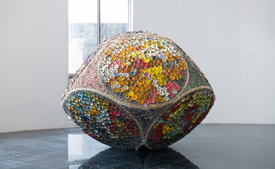 Priya Sundaravalli’s Blossoming - Being all of them, She stands there, is a stoneware with acrylic, glassware and steel. The work is inspired by Thiruvaimozhi, a collection of Tamil hymns by the 9th-century Alvar saint, Nammalvar. One of the hymns praises the Divine, Priya Sundaravalli’s Blossoming - Being all of them, She stands there, is a stoneware with acrylic, glassware and steel. The work is inspired by Thiruvaimozhi, a collection of Tamil hymns by the 9th-century Alvar saint, Nammalvar. One of the hymns praises the Divine,