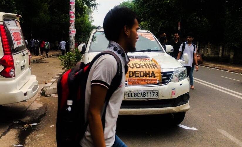 Posters campaigning for student leaders in Delhi University have been pasted on cars. Pallavi Rebbapragada/Firstpost