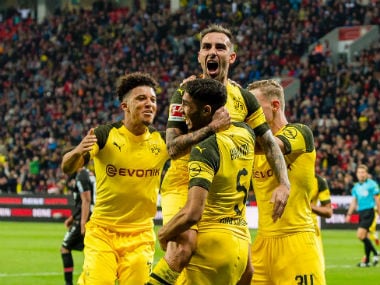Borussia Dortmund striker Paco Alcacer celebrates with his teammates after scoring a goal. Twitter: @BVB