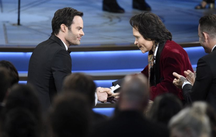 Teddy Perkins, right, congratulates Bill Hader as he gets ready to walk on stage to accept the award for outstanding lead actor in a comedy series for "Barry" at the 70th Primetime Emmy Awards on Monday, Sept. 17, 2018, at the Microsoft Theater in Los Angeles. (Photo by Chris Pizzello/Invision/AP)