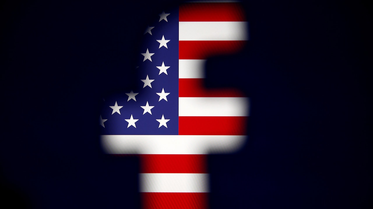 A 3D-printed Facebook logo is displayed in front of a U.S. flag in this illustration taken, March 18, 2018. REUTERS/Dado Ruvic/Illustration - RC1596567D50