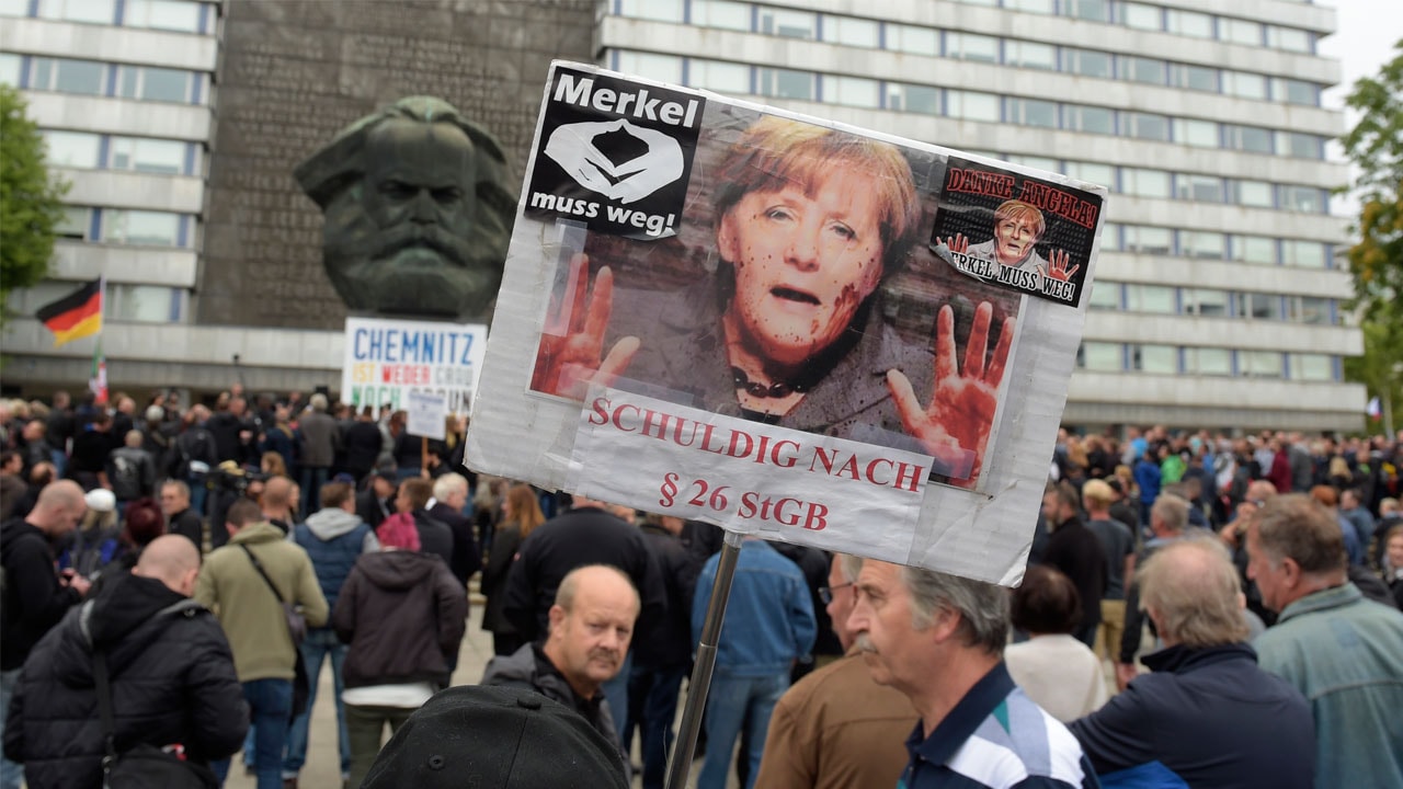 Germany protest: Thousands of supporters, opponents of Angela Merkel's ...