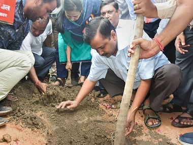Delhi chief minister Arvind Kejriwal plants a sapling during a mass plantation drive. PTI
