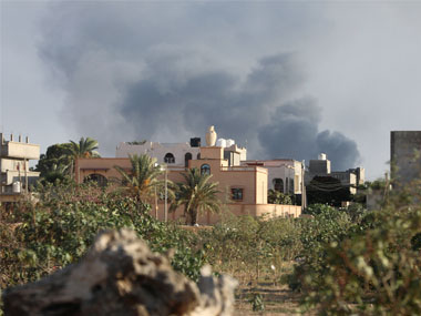 Libya unrest: Rockets pummel capital city Tripoli as rival militias clash despite truce to end fighting; three people wounded Libya unrest: Rockets pummel capital city Tripoli as rival militias clash despite truce to end fighting; three people wounded