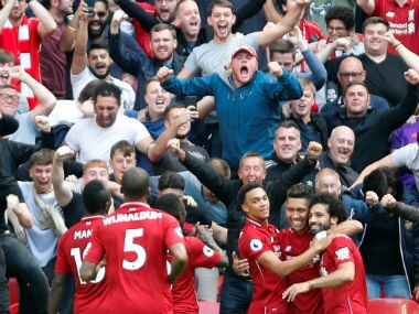 Liverpool's Roberto Firmino celebrates scoring their second goal with teammates. Reuters