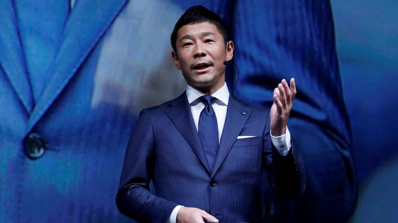 FILE PHOTO: Yusaku Maezawa, the chief executive of Zozo, which operates Japan's popular fashion shopping site Zozotown and is officially called Start Today Co, speaks at an event launching the debut of its formal apparel items, in Tokyo, Japan, July 3, 2018. REUTERS/Kim Kyung-Hoon/File Photo