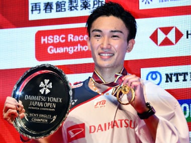 Japan's Kento Momota celebrates his victory during the award ceremony. AFP