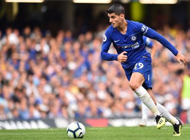 Chelsea's Spanish striker Alvaro Morata runs with the ball during the English Premier League football match between Chelsea and Arsenal at Stamford Bridge in London on August 18, 2018. / AFP PHOTO / Glyn KIRK / RESTRICTED TO EDITORIAL USE. No use with unauthorized audio, video, data, fixture lists, club/league logos or 'live' services. Online in-match use limited to 120 images. An additional 40 images may be used in extra time. No video emulation. Social media in-match use limited to 120 images. An additional 40 images may be used in extra time. No use in betting publications, games or single club/league/player publications. /