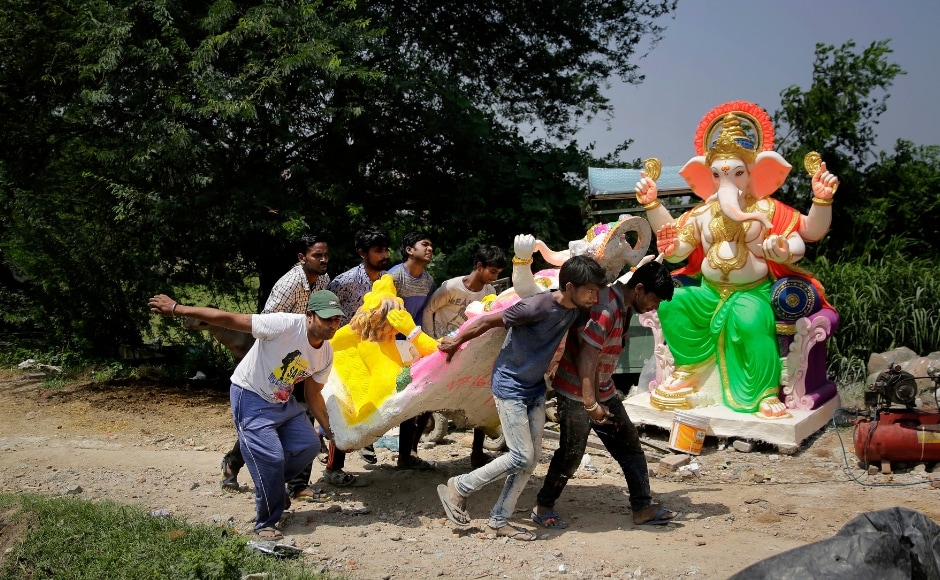 Men carrying an idol of the Hindu god Ganesha at a workshop in New Delhi ahead of the Ganesh Chaturthi festival. Ganesh Utsav traditionally commences on the fourth day of the Hindu month of Bhadrapada. Lokmanya Balgangadhar Tilak was known for initiating public celebrations of the Ganesh festival during the freedom movement. The Associated Press/ Altaf Qadri Men carrying an idol of the Hindu god Ganesha at a workshop in New Delhi ahead of the Ganesh Chaturthi festival. Ganesh Utsav traditionally commences on the fourth day of the Hindu month of Bhadrapada. Lokmanya Balgangadhar Tilak was known for initiating public celebrations of the Ganesh festival during the freedom movement. The Associated Press/ Altaf Qadri