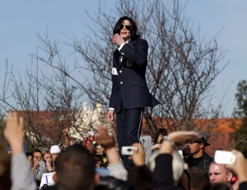 Friday, 16 Jan, 2004 file photo of Michael Jackson waves to his fans from atop his limousine after his arraignment on child molestation charges at the courthouse in Santa Maria, Calif. (AP Photo/Nick Ut)