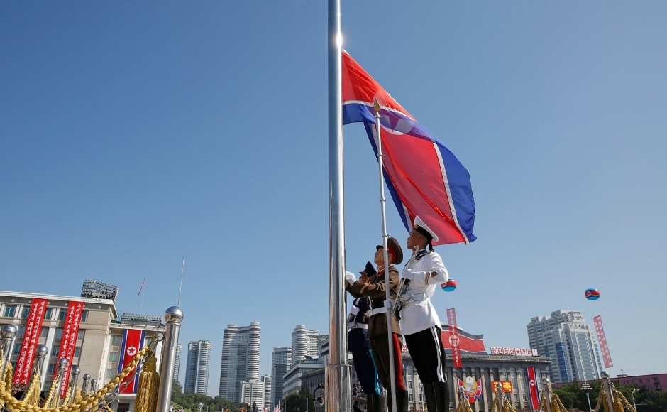 North Korea staged a huge military parade on Sunday to mark its 70th anniversary as a nation. Soldiers raised the country's national flag before the parade started in Pyongyang. AP North Korea staged a huge military parade on Sunday to mark its 70th anniversary as a nation. Soldiers raised the country's national flag before the parade started in Pyongyang. AP