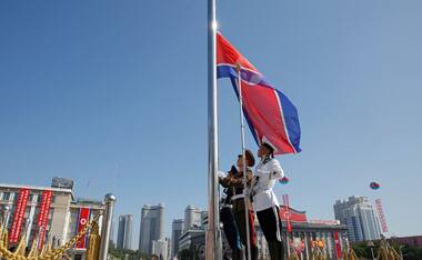 North Korea parades troops, artillery to mark 70th anniversary as nation in Pyongyang; Kim Jong-un, Chinese envoy attend