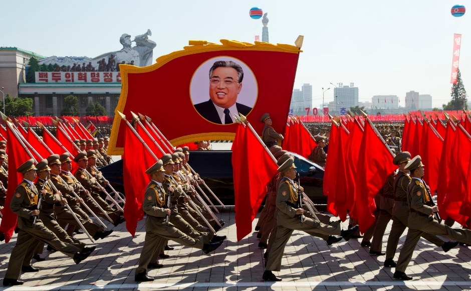 Soldiers march with a float showing late North Korean leader Kim Il Sung, Nearly half of the parade was devoted to civilian efforts to build the domestic economy. AP Soldiers march with a float showing late North Korean leader Kim Il Sung, Nearly half of the parade was devoted to civilian efforts to build the domestic economy. AP