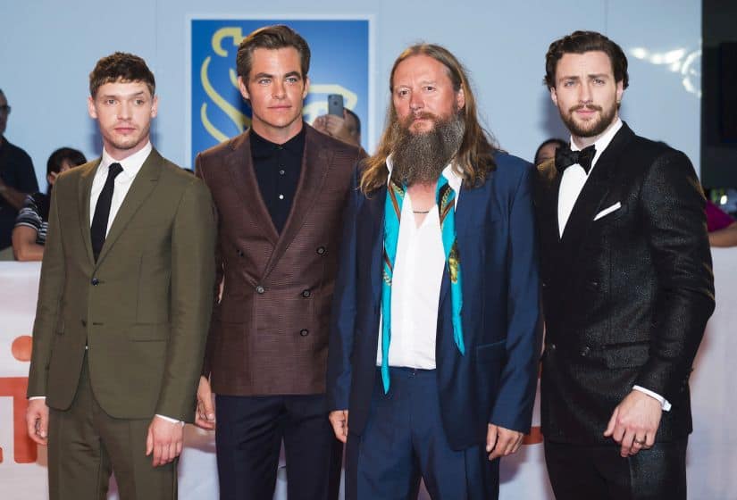 Actors Billy Howle, left, Chris Pine, second left, director David Mackenzie, second right, and actor Aaron Taylor-Johnson, right, pose for photographs on the red carpet after arriving for the new movie 