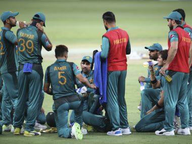 Pakistan’s captain Sarfraz Ahmed (centre) interacts with teammates at a drinks break. AP Photo