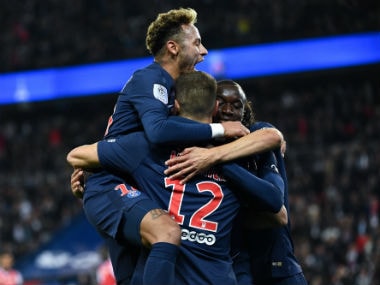 Paris Saint-Germain's Belgian defender Thomas Meunier (C back) is congratulated by teammates including Paris Saint-Germain's Brazilian forward Neymar. AFP