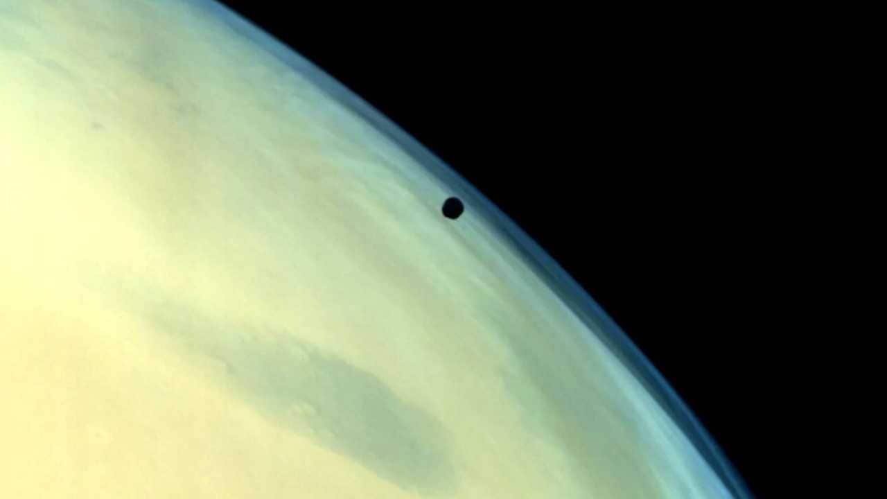 Mars's moon Phobos against the planet's not-so-red-looking surface. Image courtesy: ISRO