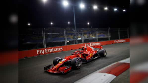 Singapore Grand Prix: Kimi Raikkonen pips Lewis Hamilton to set fastesr lap as Sebastian Vettel hits wall in second practice