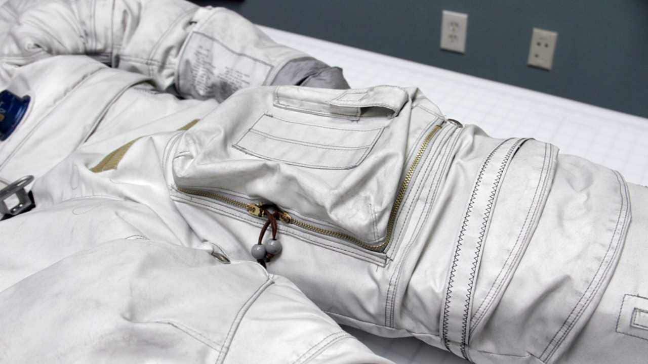 Space suits required material that was durable, strong, lightweight, flexible, and noncombustible, all of which NASA found in fiberglass fabric coated with polytetrafluoroethylene PTFE, commonly known as Teflon. Image courtesy: CollectSpace