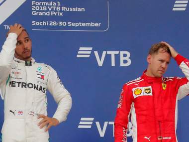 Formula One F1 - Russian Grand Prix - Sochi, Russia - September 30, 2018 Mercedes' Lewis Hamilton after winning the race alongside third placed Ferrari's Sebastian Vettel REUTERS/Maxim Shemetov - RC121C9D8EB0