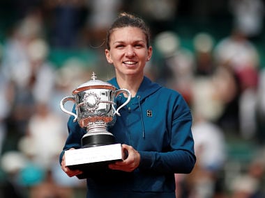 Tennis - French Open - Roland Garros, Paris, France - June 9, 2018 Romanias Simona Halep celebrates with the trophy after winning the final against Sloane Stephens of the U.S. REUTERS/Benoit Tessier - RC1648D03810
