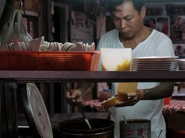 Yen Wei-shun, a former criminal turned noodle shop owner for charity, prepares food at his noodle shop in Panchiao district, New Taipei City. AFP