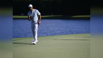 FedEx Cup: Tiger Woods shares lead with Justin Rose in Tour Championship at halfway stage; Rory McIlroy still in contention