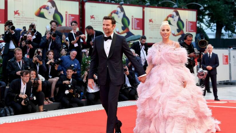 Bradley Copper (left) and Lady Gaga arrive on the red carpet for A Star Is Born. Image from Twitter