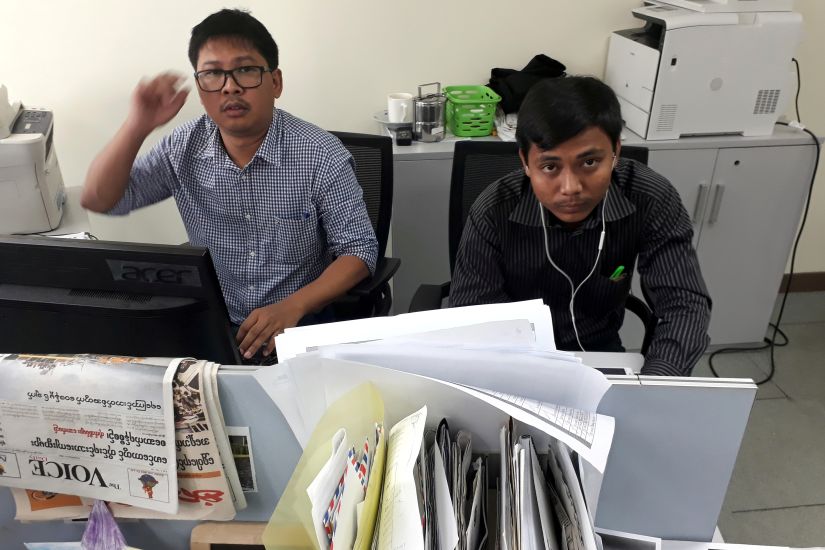 File image of Reuters journalists Wa Lone (L) and Kyaw Soe Oo, who are based in Myanmar, pose for a picture at the Reuters office in Yangon, Myanmar. Reuters