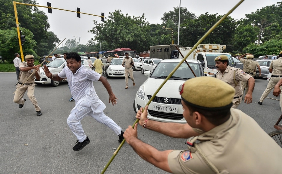 In New Delhi, policemen lathi-charged members of the Indian Youth Congress staging protests during the Bharat Bandh. PTI In New Delhi, policemen lathi-charged members of the Indian Youth Congress staging protests during the Bharat Bandh. PTI