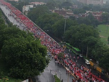 Determined to be heard, farmers and workers turn Delhi into sea of red, march from Ramlila Maidan to Parliament Street Determined to be heard, farmers and workers turn Delhi into sea of red, march from Ramlila Maidan to Parliament Street