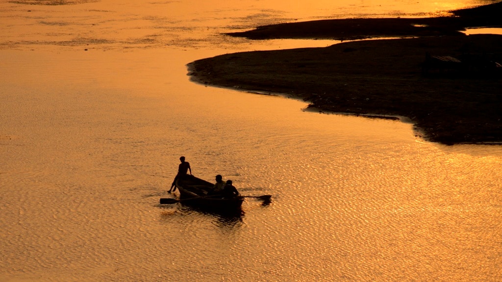 A lonely boat on the river Ganga — REUTERS