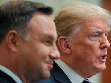 US President Donald Trump stands with Poland's President Andrzej Duda in the White House on Tuesday. Reuters