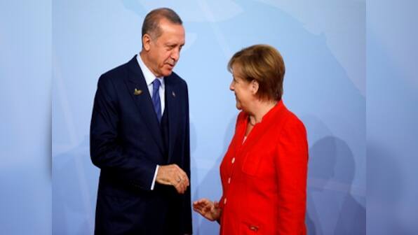 Recep Tayyip Erdogan to hold talks with Angela Merkel amid protests on Turkey president's first State visit to Germany