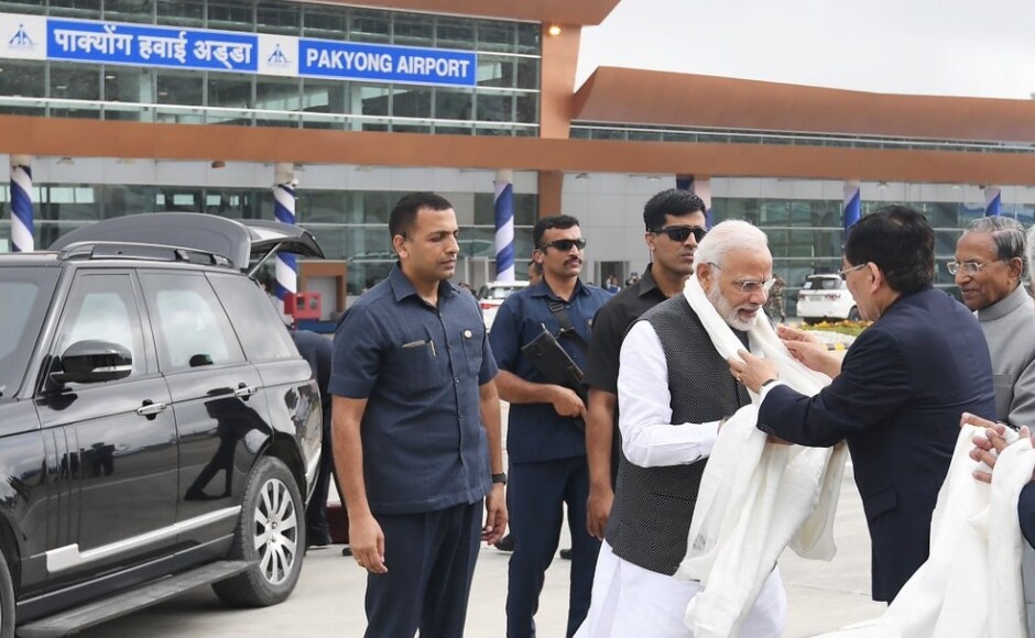 The prime minister arrived in Gangtok on Sunday in an MI-8 chopper from Bagdogra. He was received by Governor Ganga Prasad, Chief Minister Pawan Chamling and others at the Libing Army Helipad. He was given a gun salute by the army on arrival. Twitter/@narendramodi The prime minister arrived in Gangtok on Sunday in an MI-8 chopper from Bagdogra. He was received by Governor Ganga Prasad, Chief Minister Pawan Chamling and others at the Libing Army Helipad. He was given a gun salute by the army on arrival. Twitter/@narendramodi